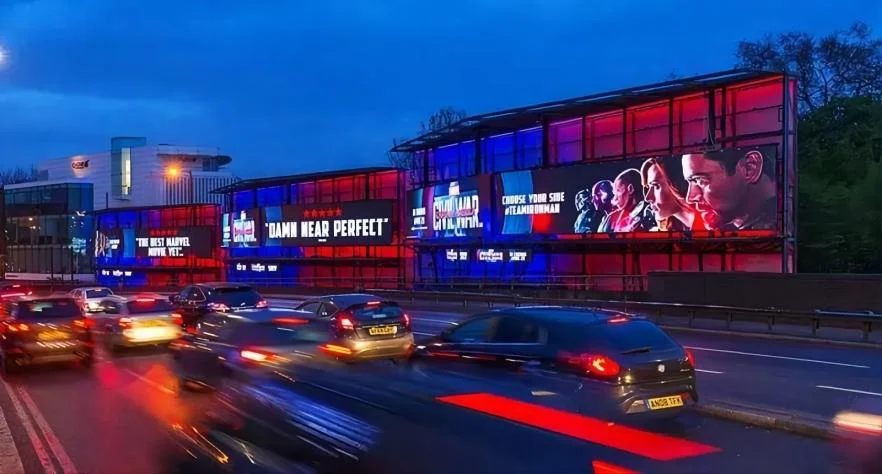 Large outdoor LED media screens operating beside a roadway