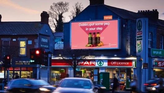 Outdoor LED display installed on a roadside commercial building